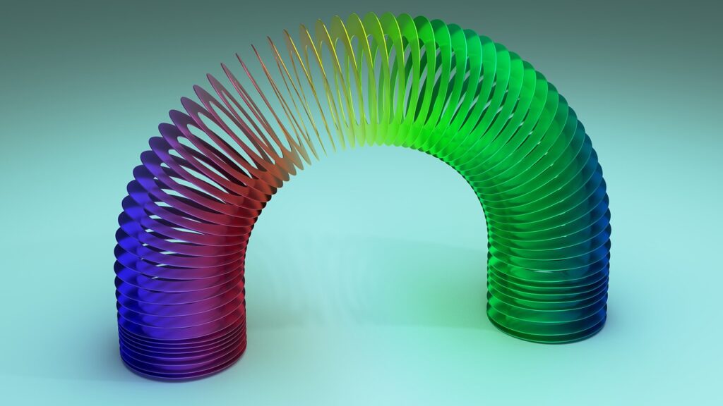 slinky, spring, rainbow, colorful, metallic, reflect, stretch, stretching, curve, flexible, coil, toy, elasticity, arch, closeup, nature, macro, spectrum, spiral, tension, twisted, 3d, play, circle, helix, vibrant